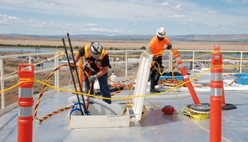 Assisting diver from top of water tank